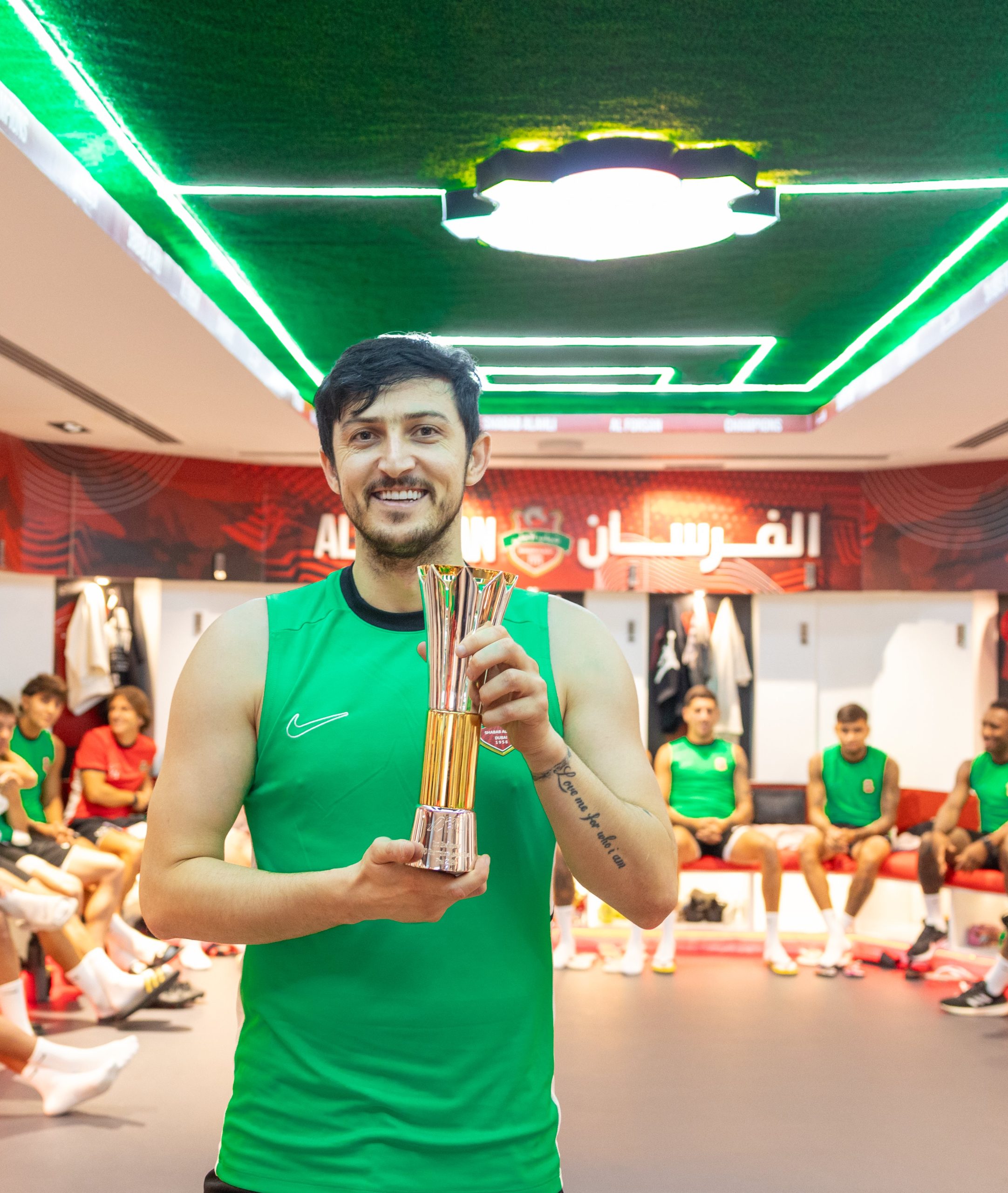 our player Sardar Azmoun celebrates with his teammates